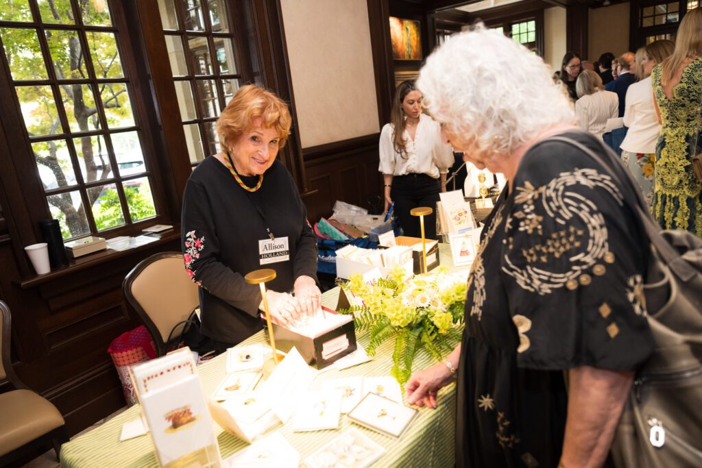 Women browsing at a raffle table