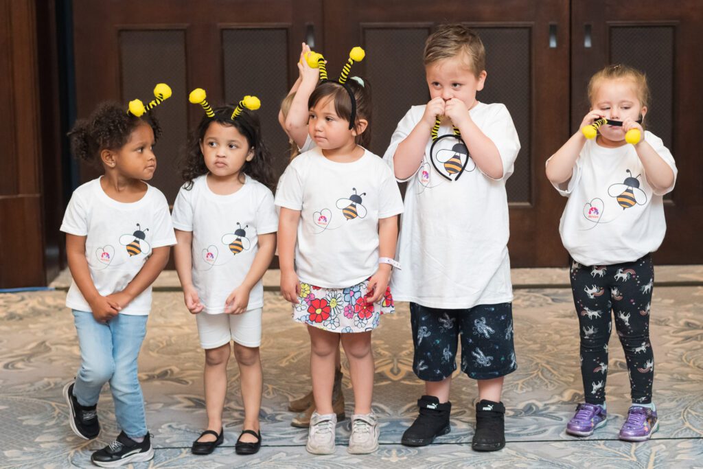 Children in bee antennae headbands