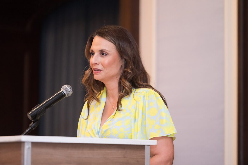 Woman speaking at a podium