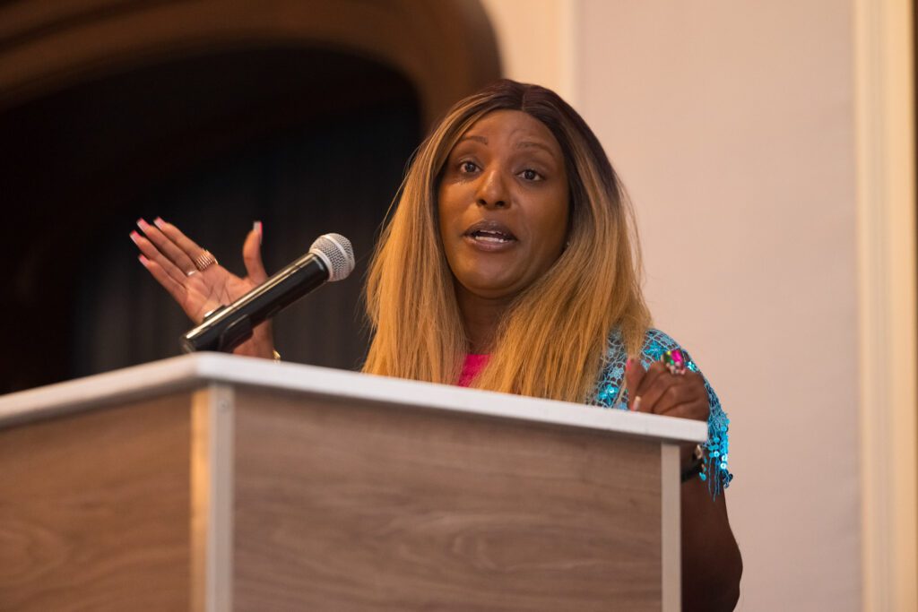 Woman speaking at a podium