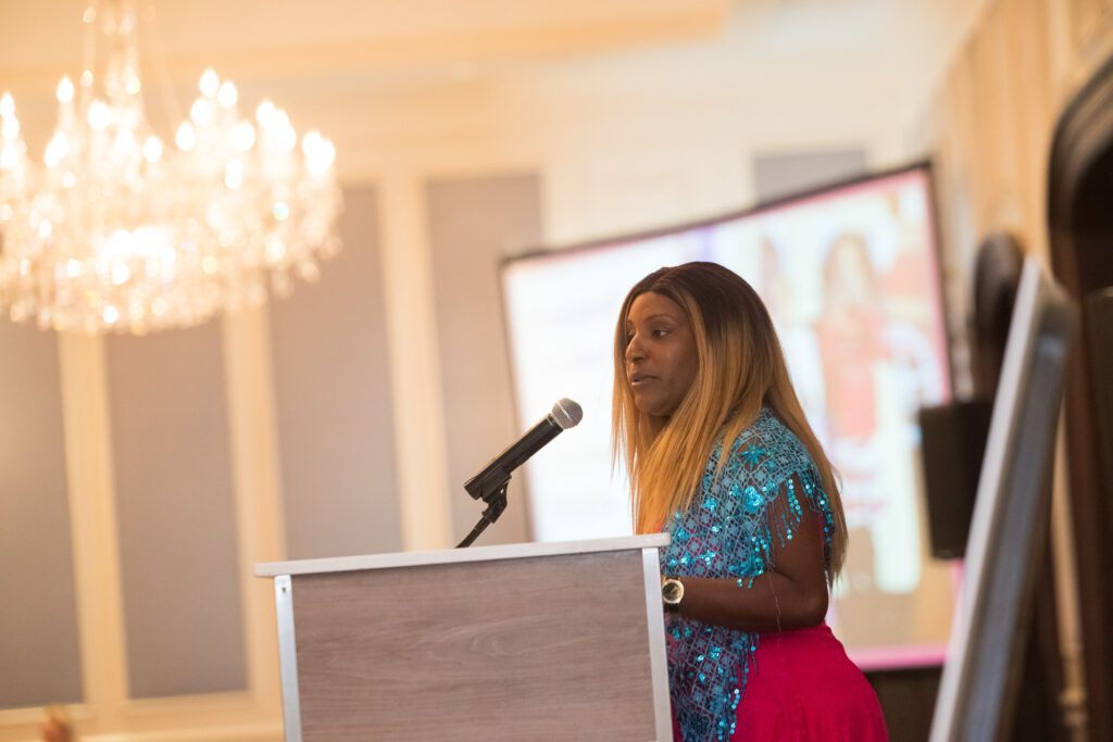 Woman giving a presentation in a ballroom