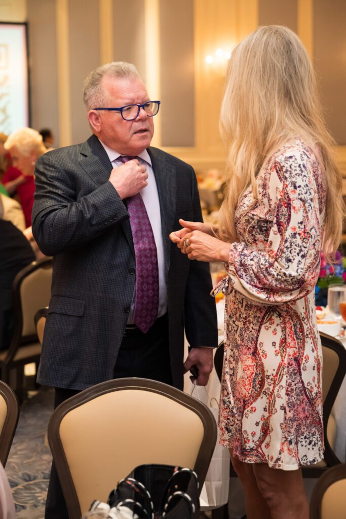 Two luncheon guests talking