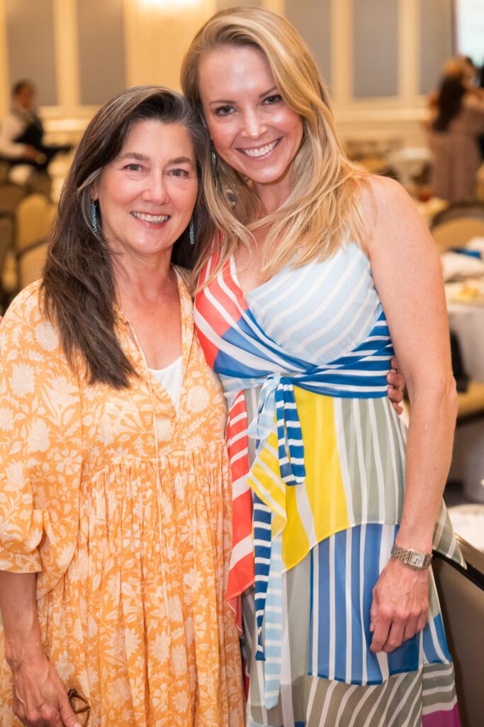 Two women hugging and smiling