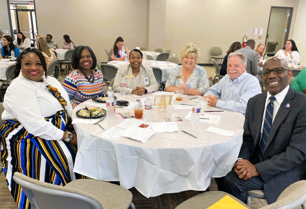 Pathways guests seated at table