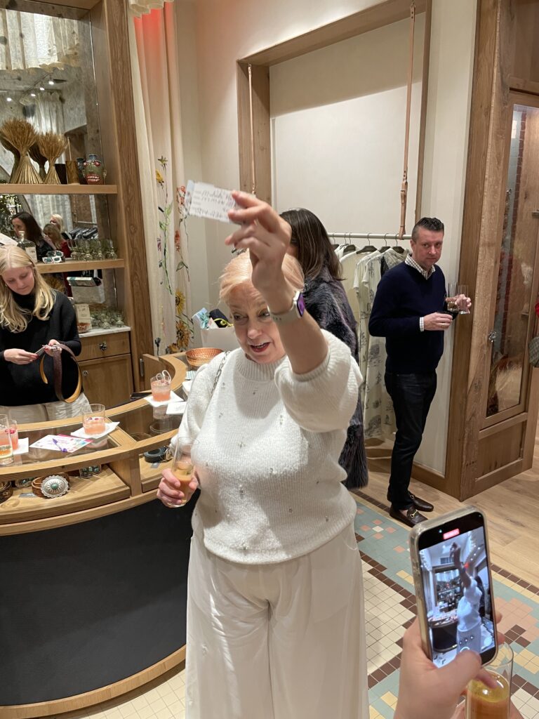 woman holding raffle ticket