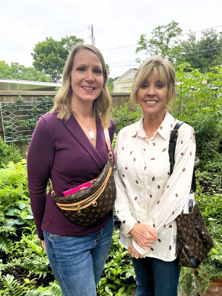 two women smiling in garden