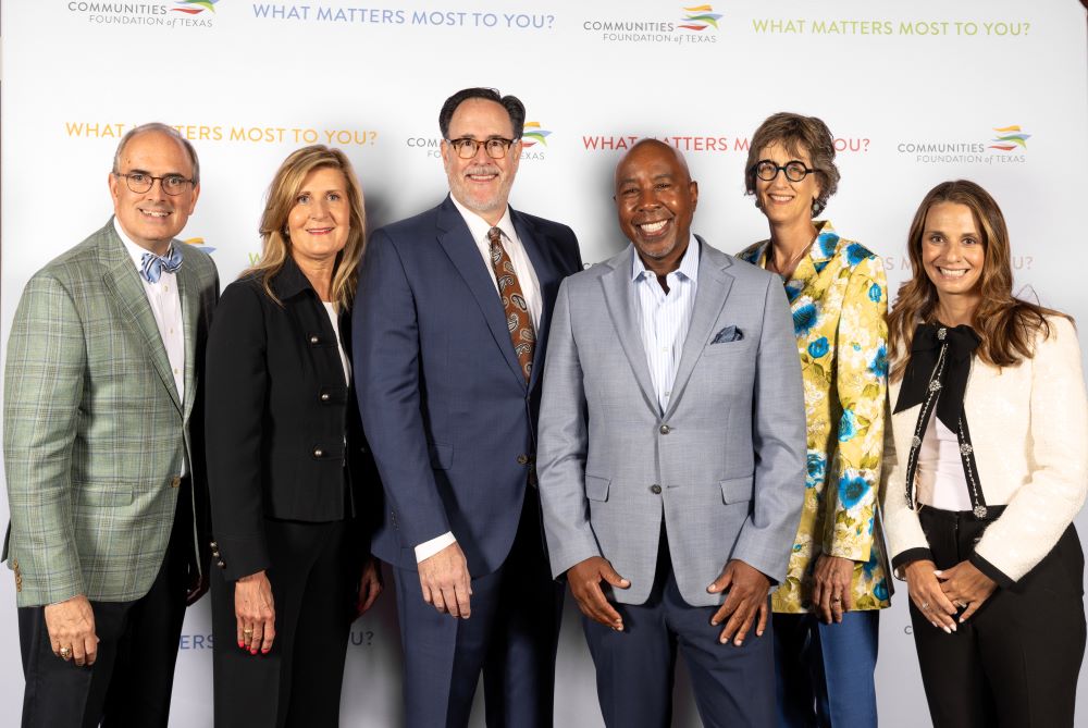 siz people posing for grant award announcement