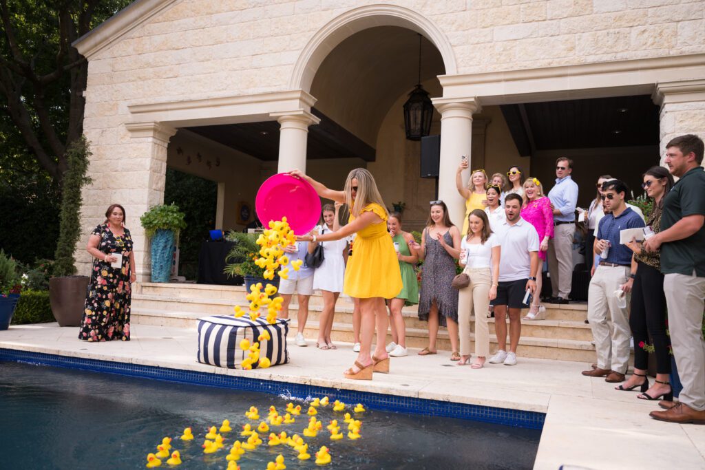 Dumping rubber ducks into pool